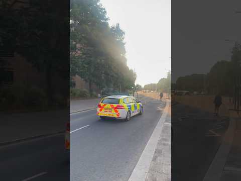 Police car and electric scooter on a main road together at sunset #driving #electricscooter