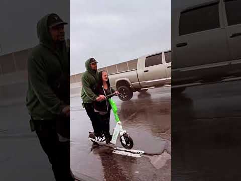 Idiot rides electric scooter on Colorado expressway with crackhead gf in rain